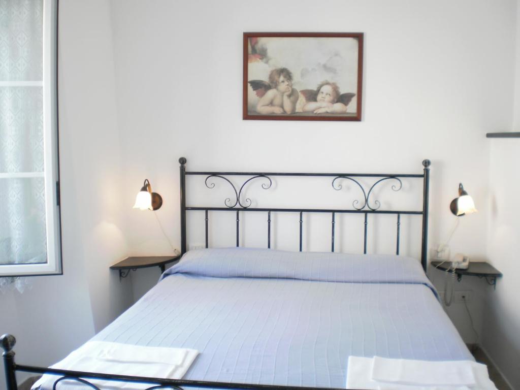 Postel nebo postele na pokoji v ubytování Hotel Paese Corvara