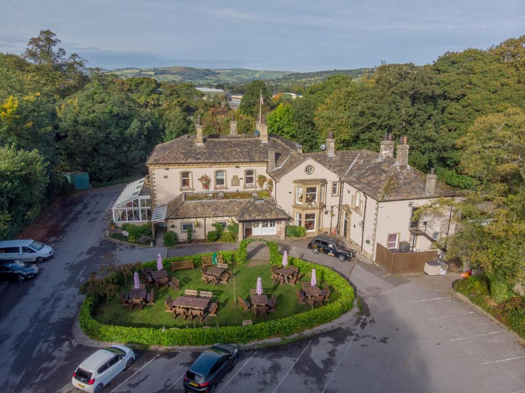 an aerial view of a house with a yard at Steeton Hall Hotel & Restaurant in Steeton