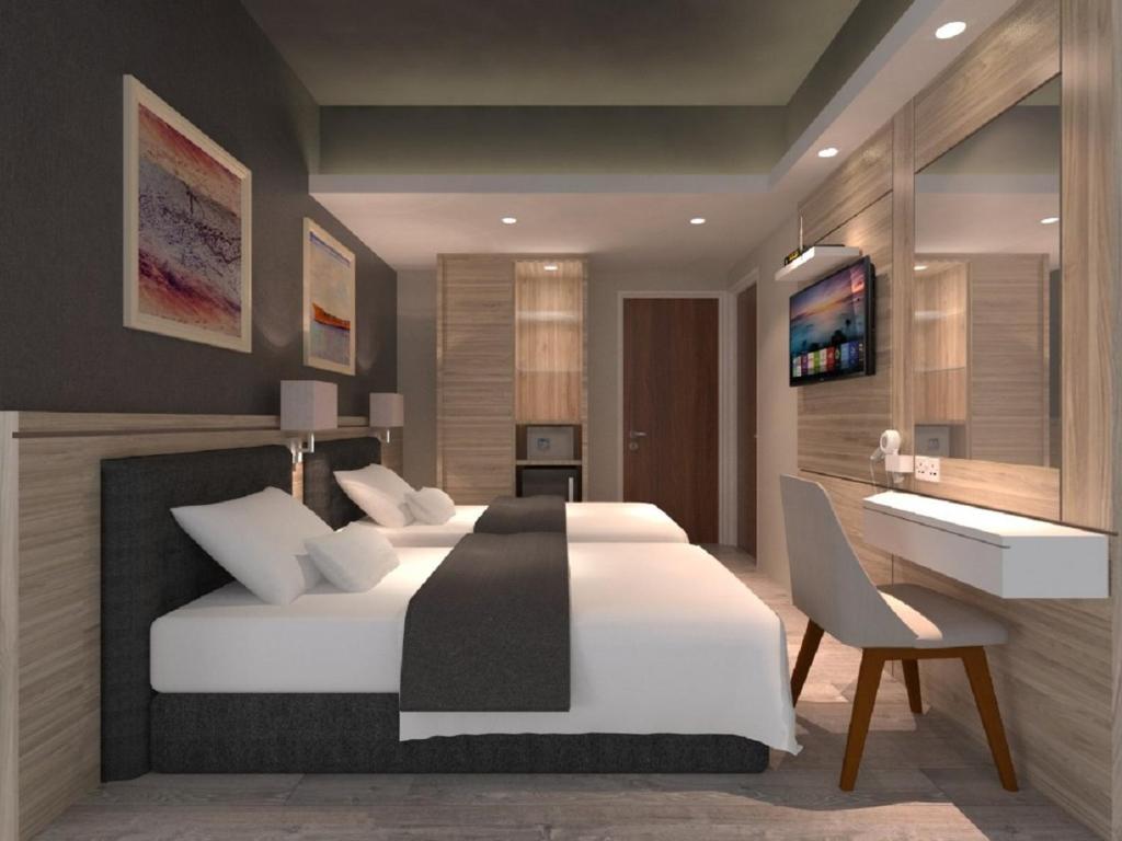 Postel nebo postele na pokoji v ubytování Grand Hallmark Hotel - Johor Bahru