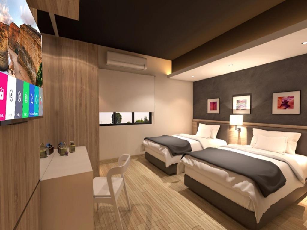 Postel nebo postele na pokoji v ubytování Grand Hallmark Hotel - Johor Bahru