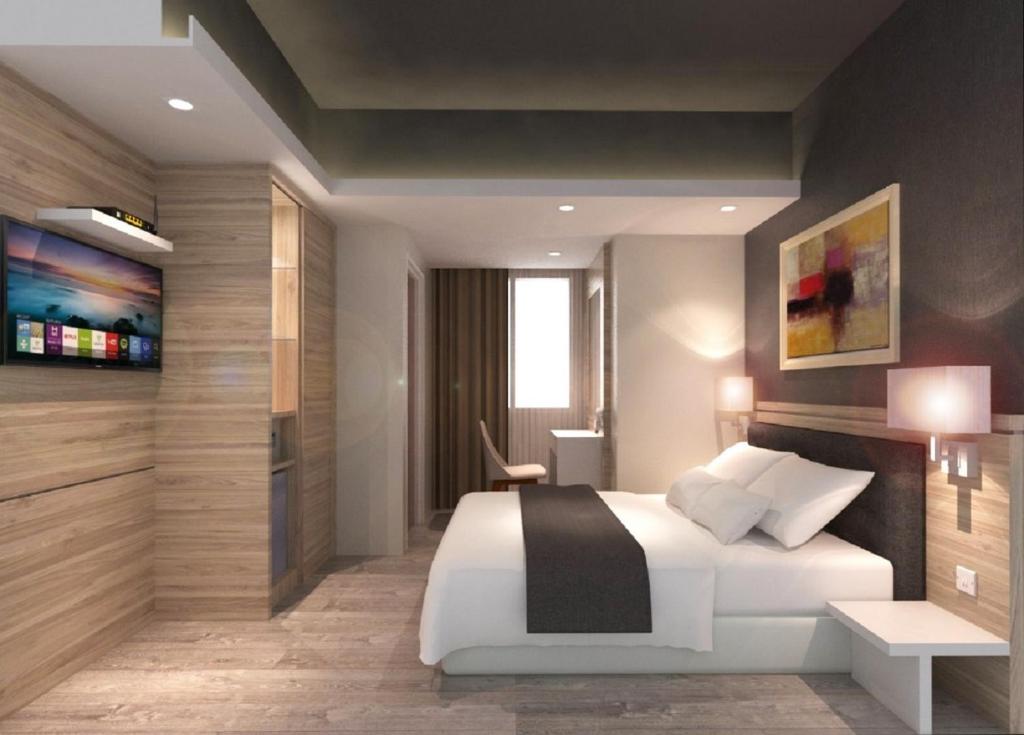 Postel nebo postele na pokoji v ubytování Grand Hallmark Hotel - Johor Bahru