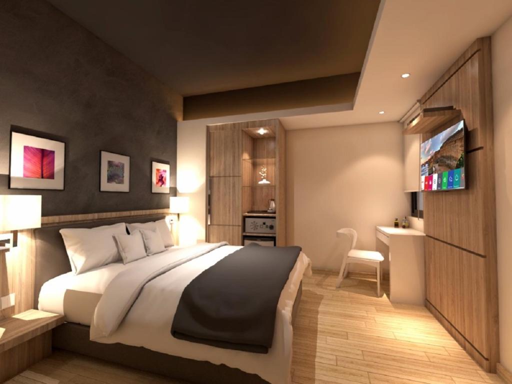 Postel nebo postele na pokoji v ubytování Grand Hallmark Hotel - Johor Bahru