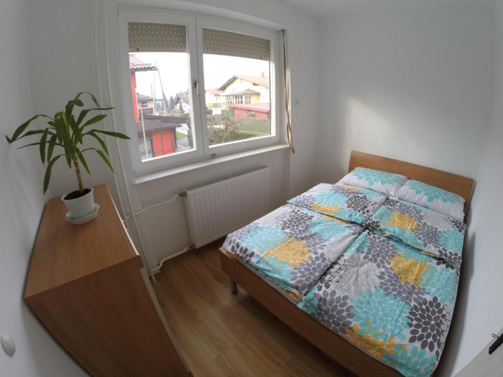 Postel nebo postele na pokoji v ubytování Apartments Andrej - Poetovio & Ptuj