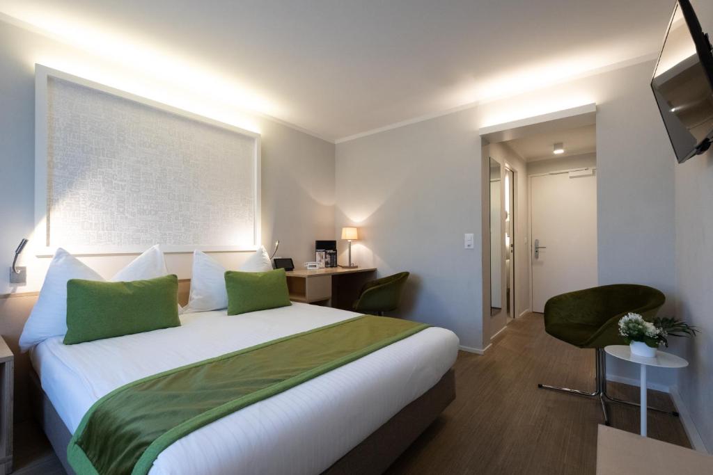 Postel nebo postele na pokoji v ubytování Hotel Spirgarten