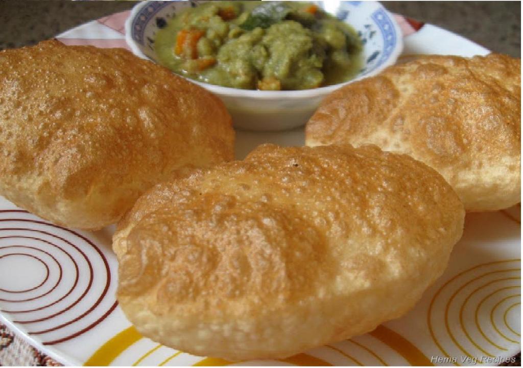 a plate with three rolls and a bowl of food at Rks Homestay in Hampi