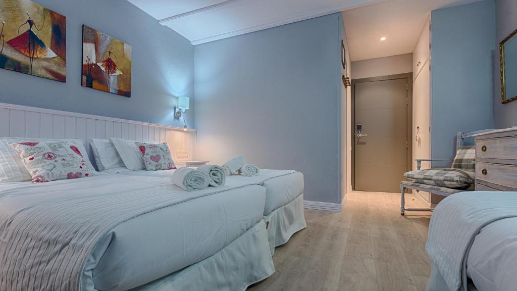 Postel nebo postele na pokoji v ubytování Hotel Ribaeta