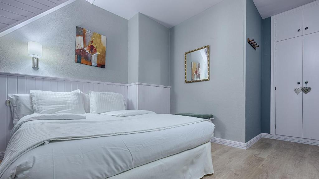 Postel nebo postele na pokoji v ubytování Hotel Ribaeta