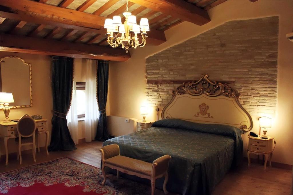 Postel nebo postele na pokoji v ubytování Villa Rinalducci