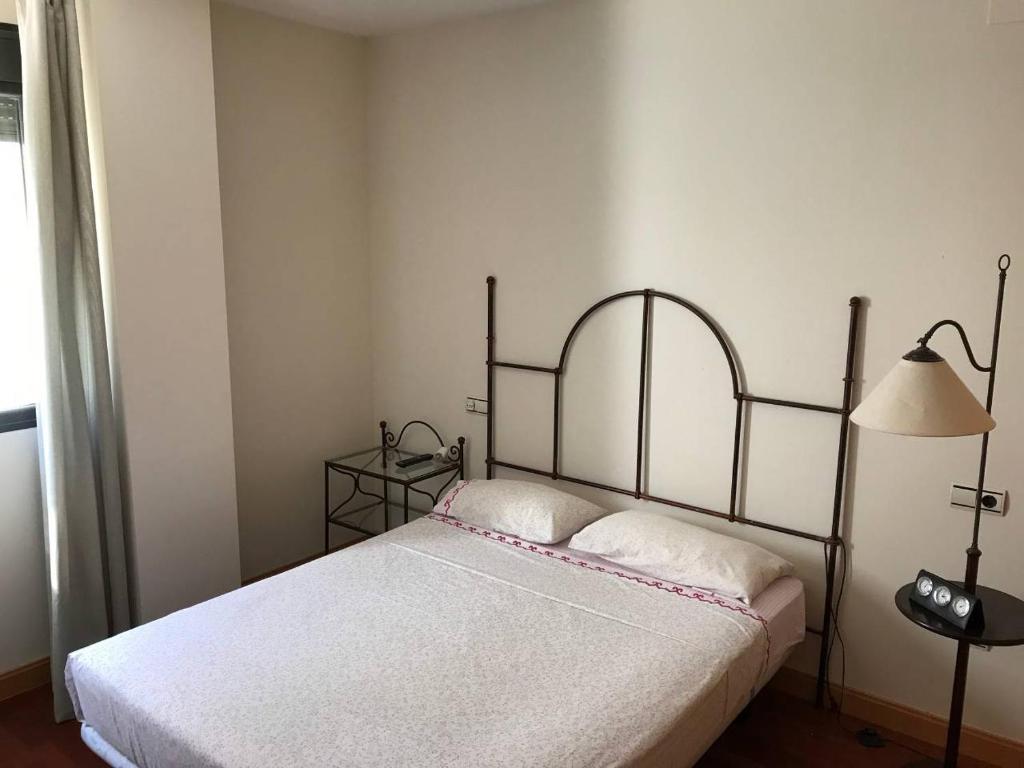 Postel nebo postele na pokoji v ubytování Villa de Madrid 17