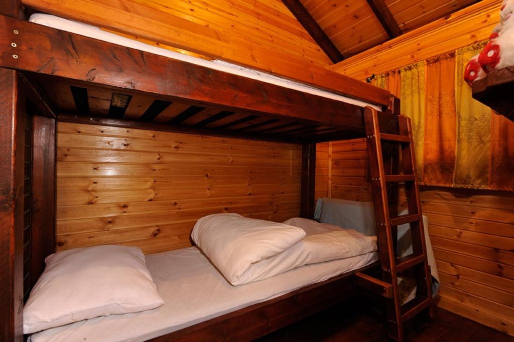 Postel nebo postele na pokoji v ubytování Noa'm Bagalil