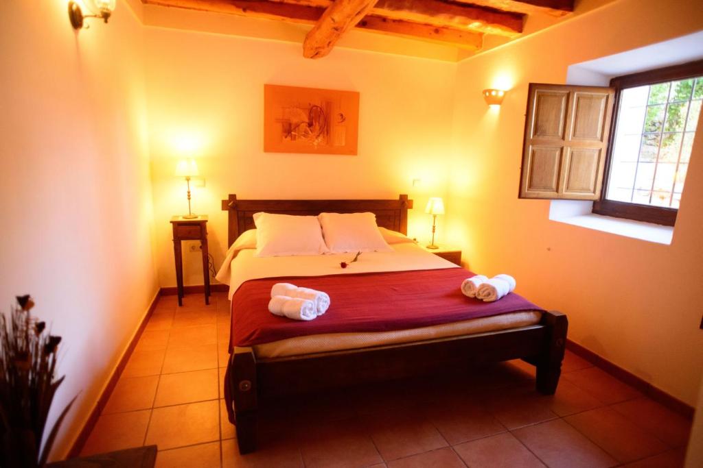 A bed or beds in a room at Can Vich