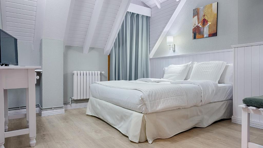 Postel nebo postele na pokoji v ubytování Hotel Ribaeta