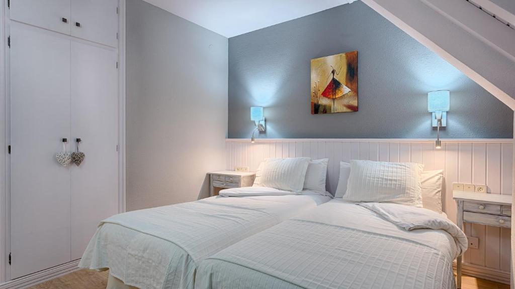 Postel nebo postele na pokoji v ubytování Hotel Ribaeta
