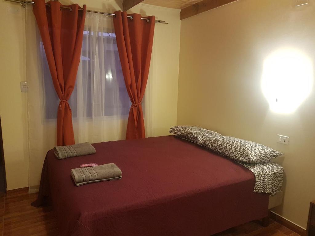 Postel nebo postele na pokoji v ubytování Hostal Ckamai