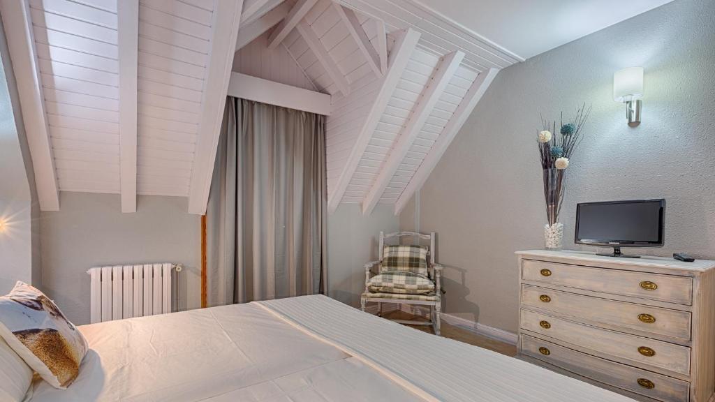 Postel nebo postele na pokoji v ubytování Hotel Ribaeta