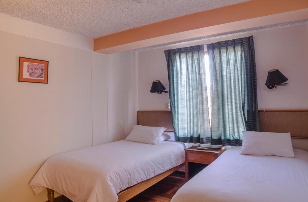 Postel nebo postele na pokoji v ubytování Los Aticos B&B with Coworking