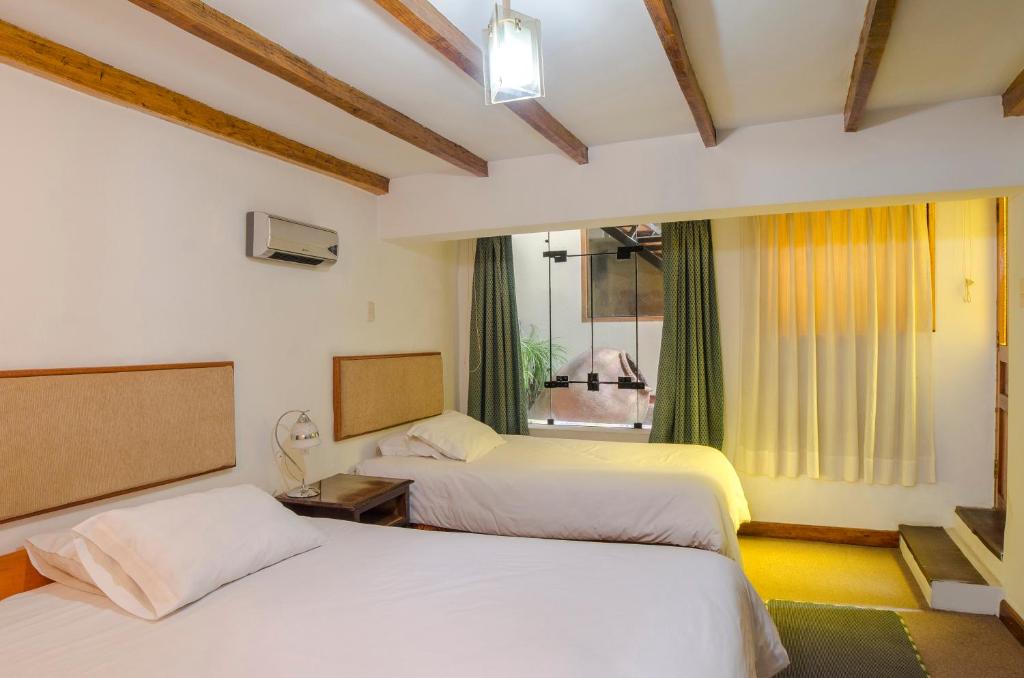 Postel nebo postele na pokoji v ubytování Los Aticos B&B with Coworking