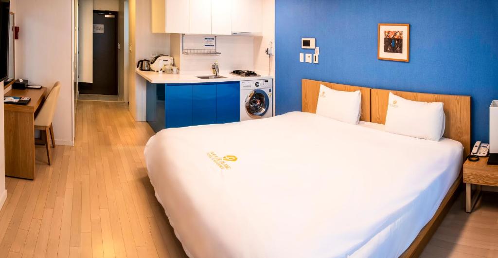 Postel nebo postele na pokoji v ubytování Plea De Blanc Hotel & Residence