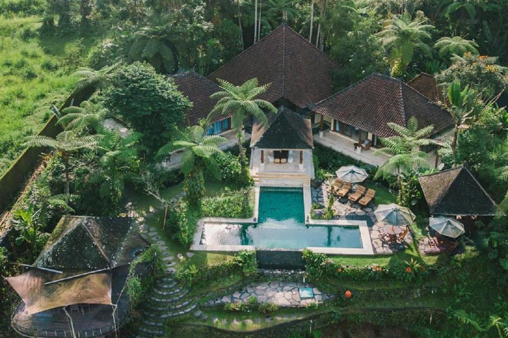 an aerial view of a house with a swimming pool at Heaven in Bali in Penginyahan