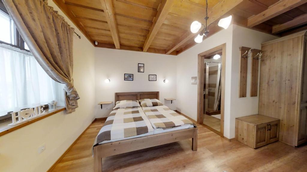 Postel nebo postele na pokoji v ubytování Tóth Vendégház és Apartmanház Újfehértó