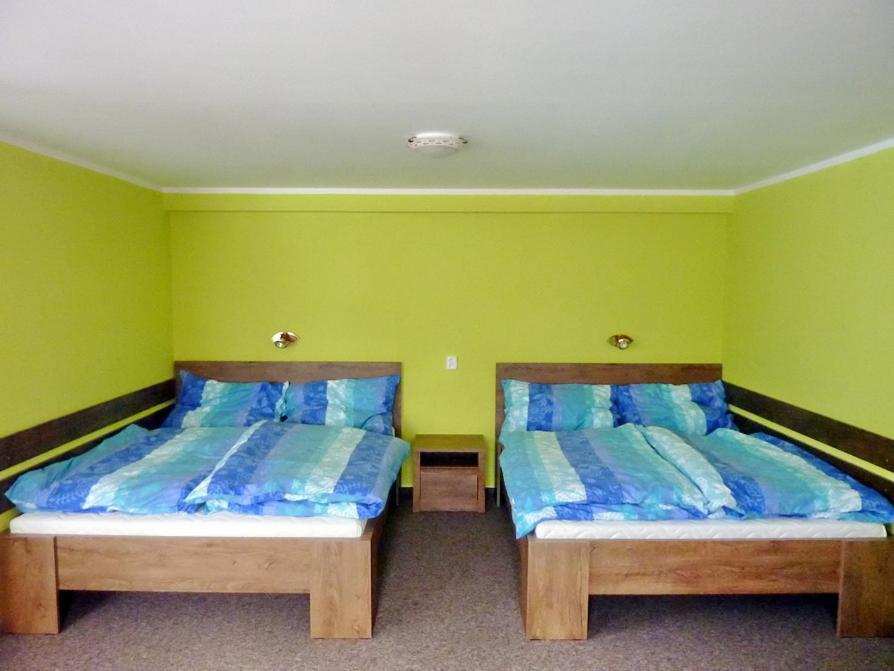 Postel nebo postele na pokoji v ubytování Albrechtice v Jizerských horách 188