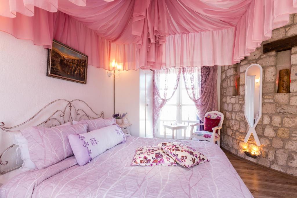 Postel nebo postele na pokoji v ubytování Chigdem Hotel-Special Category