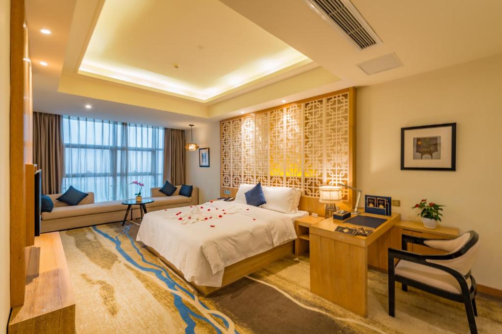 Postel nebo postele na pokoji v ubytování Chongqing Shanggao Hotel