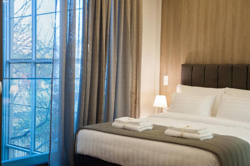 Postel nebo postele na pokoji v ubytování Athens Platinum Rooms and Suites
