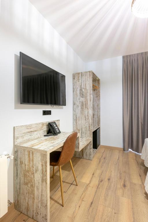 TV a/nebo společenská místnost v ubytování Hostal Anton Martin
