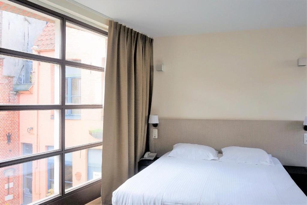Postel nebo postele na pokoji v ubytování Hotel 't Putje