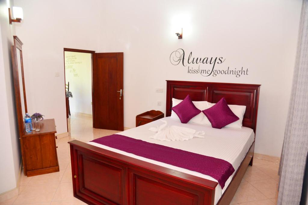 A bed or beds in a room at Cinnamon Holiday Inn