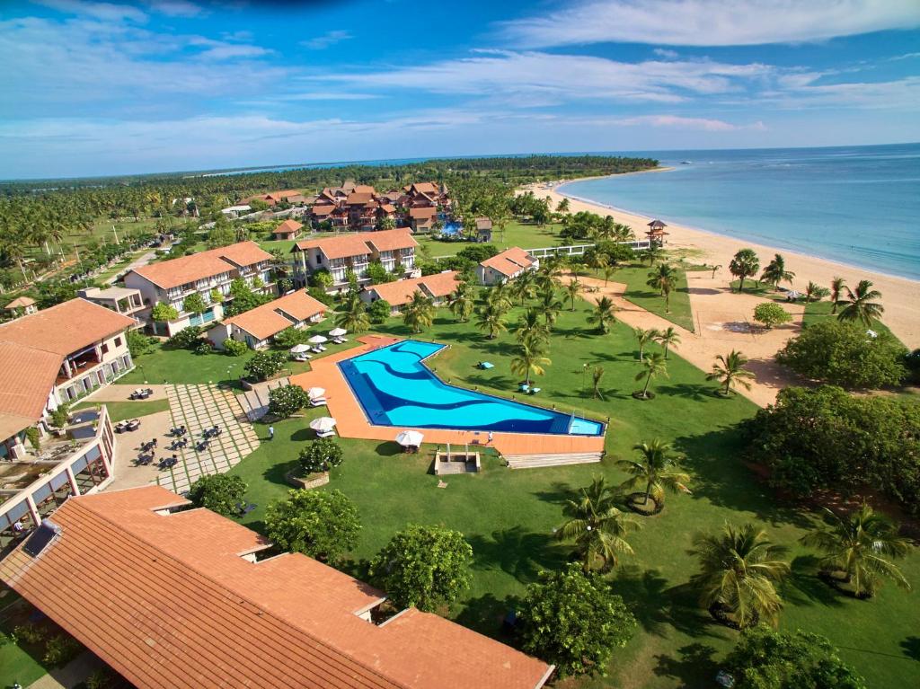 an aerial view of a resort and the beach at The Calm Resort & Spa in Pasikuda