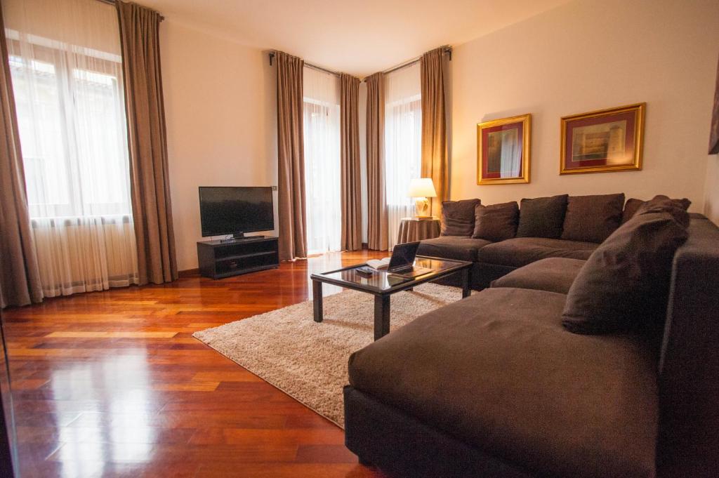 a living room with a couch and a table at Italianflat - Via Mazzini in Verona