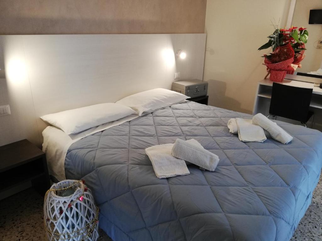 Postel nebo postele na pokoji v ubytování Hotel Tosi