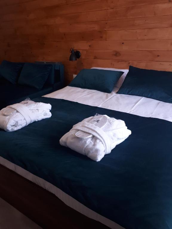 Postel nebo postele na pokoji v ubytování New Gudauri, loft 2, Apartment 309, RED CO