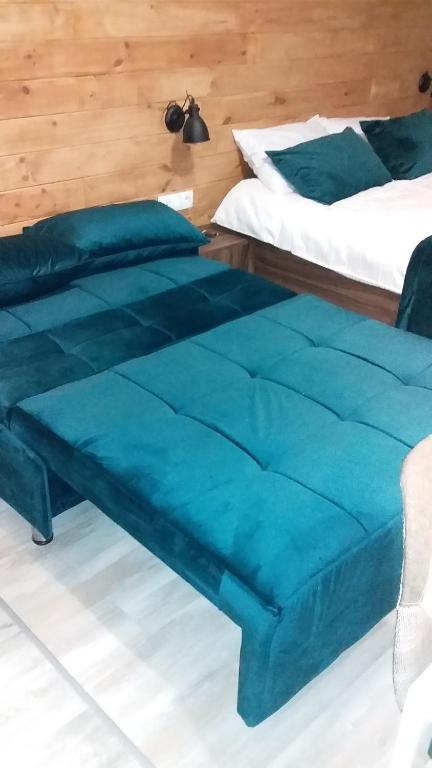 Postel nebo postele na pokoji v ubytování New Gudauri, loft 2, Apartment 309, RED CO