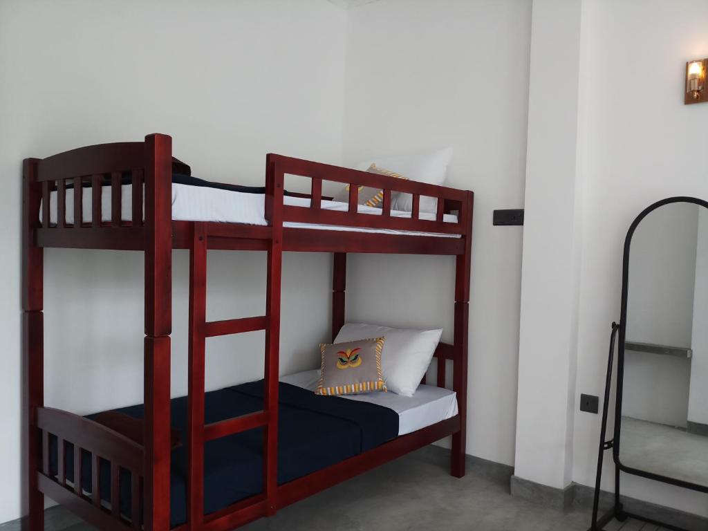 Postel nebo postele na pokoji v ubytování Blossom Inn