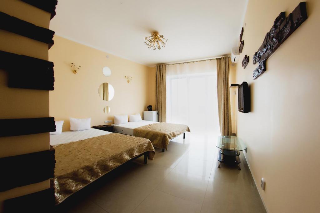 Postel nebo postele na pokoji v ubytování VIP Hotel