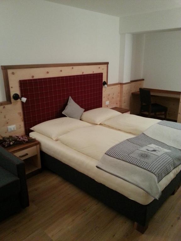 Postel nebo postele na pokoji v ubytování Hotel Alcialc
