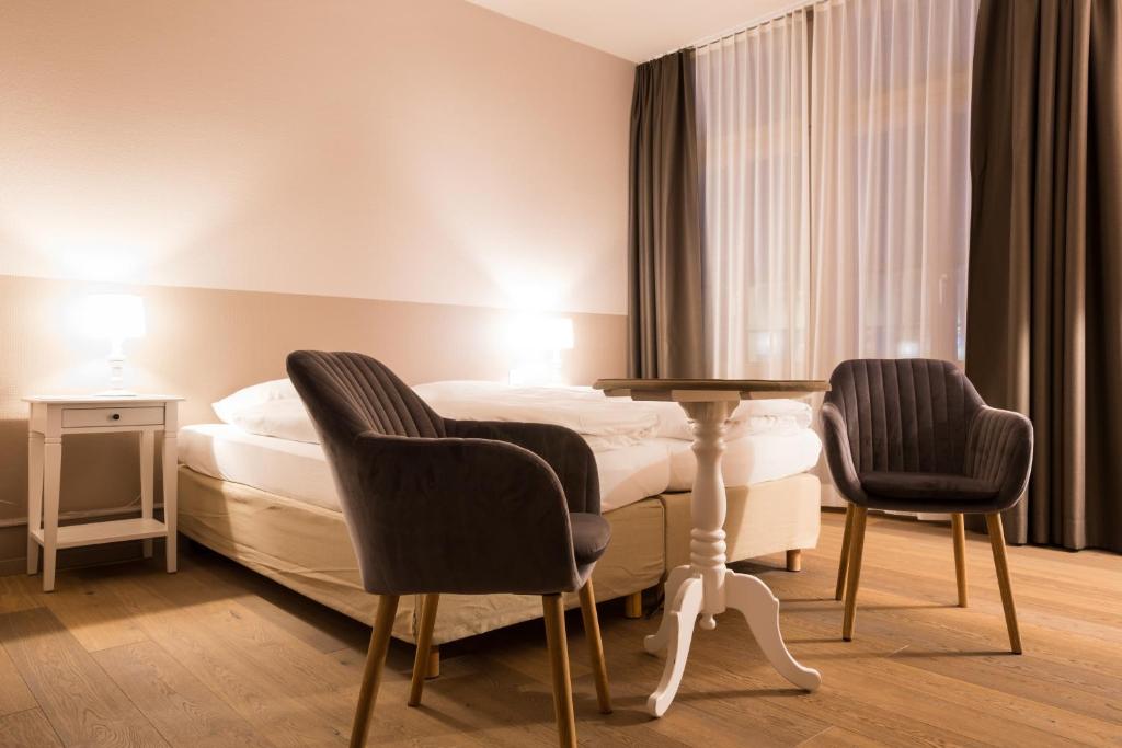 Letto o letti in una camera di Hotel Emmental