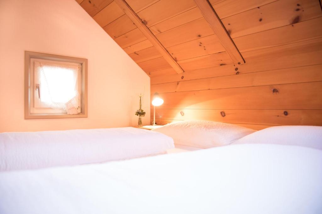 Postel nebo postele na pokoji v ubytování Hotel Toggenburgerhof