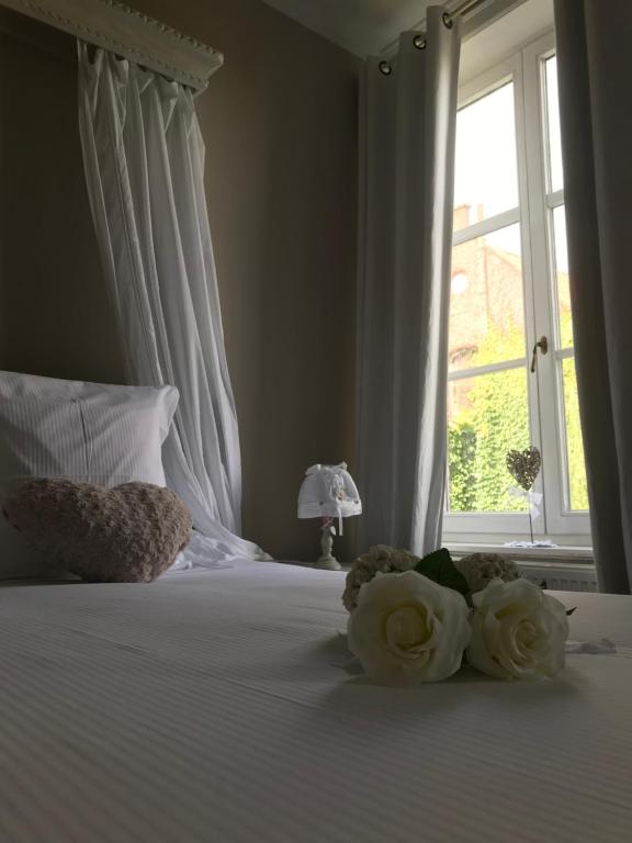 Postel nebo postele na pokoji v ubytování B&B Le Cloître St Joseph