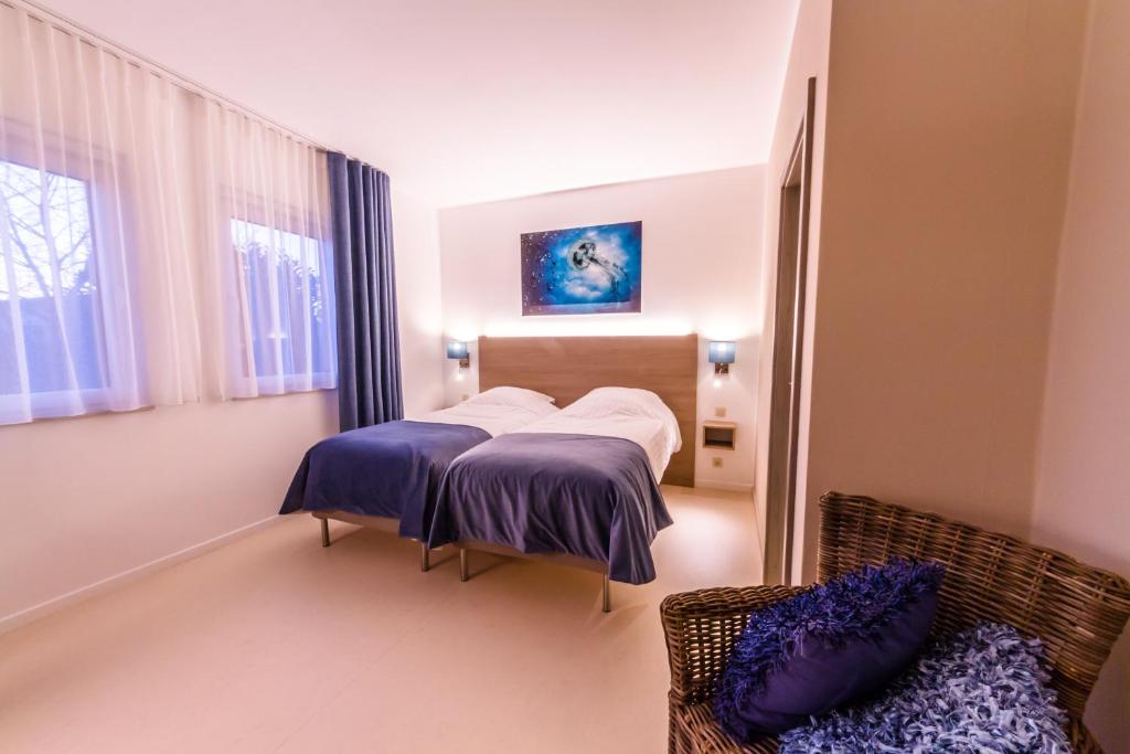 Postel nebo postele na pokoji v ubytování ManavaHotel