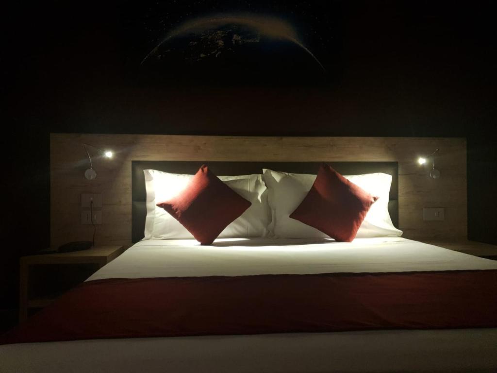 Postel nebo postele na pokoji v ubytování Hotel Stradivari