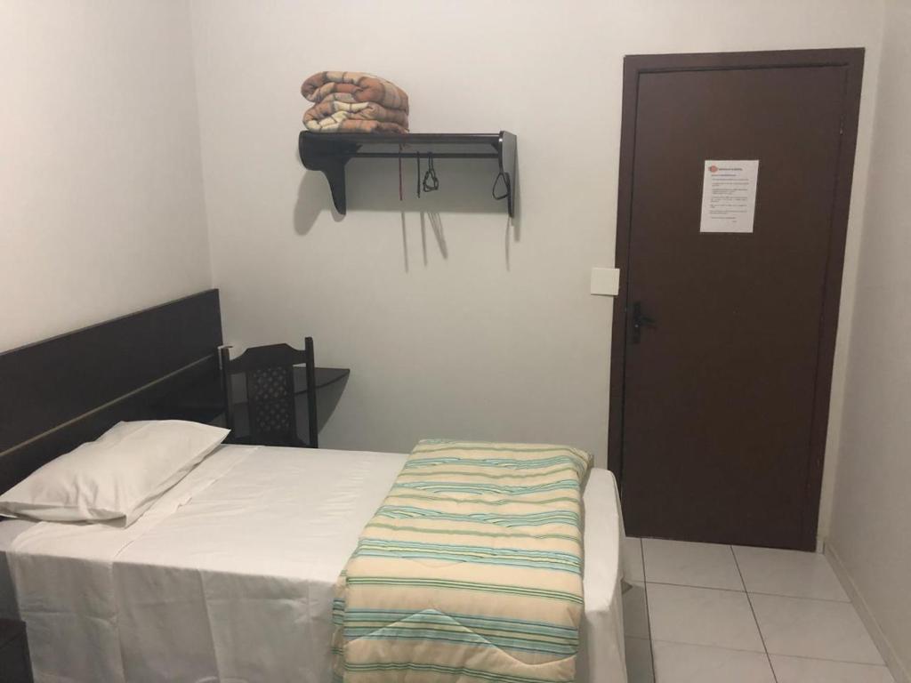 Postel nebo postele na pokoji v ubytování Residence Hotel Ltda