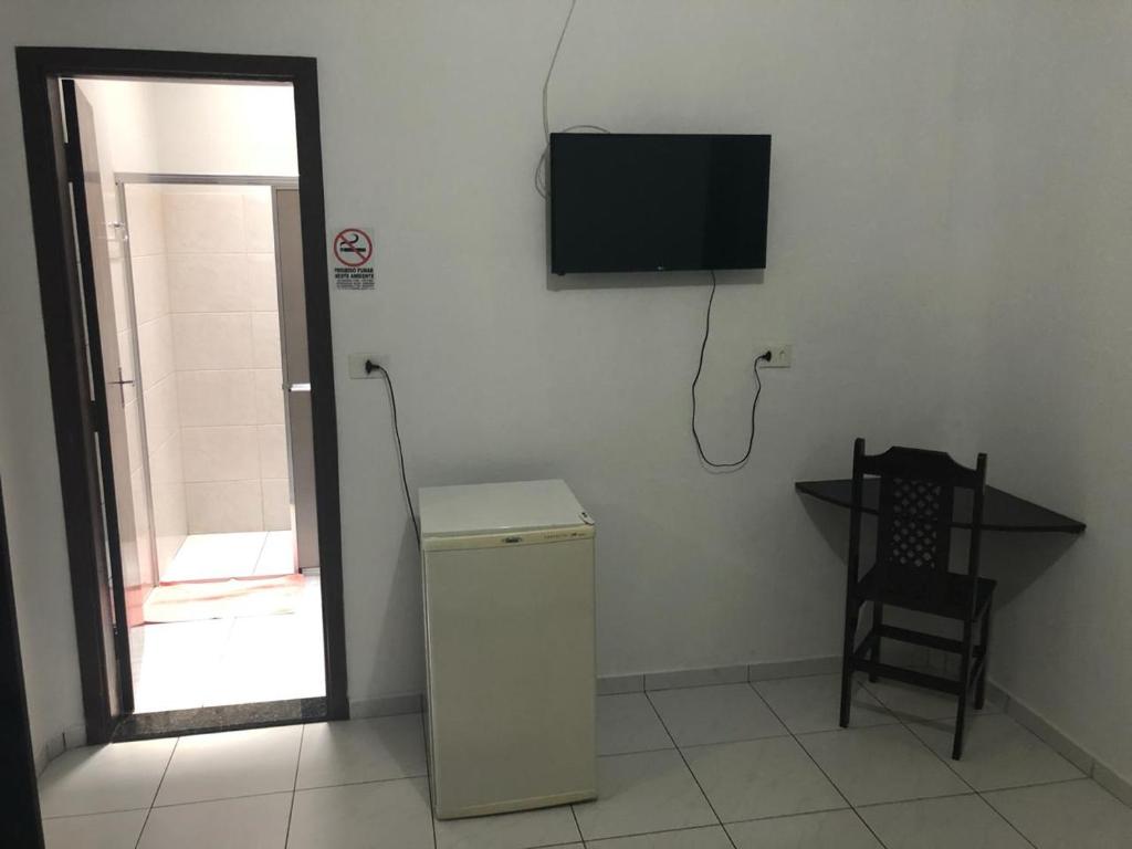 TV a/nebo společenská místnost v ubytování Residence Hotel Ltda