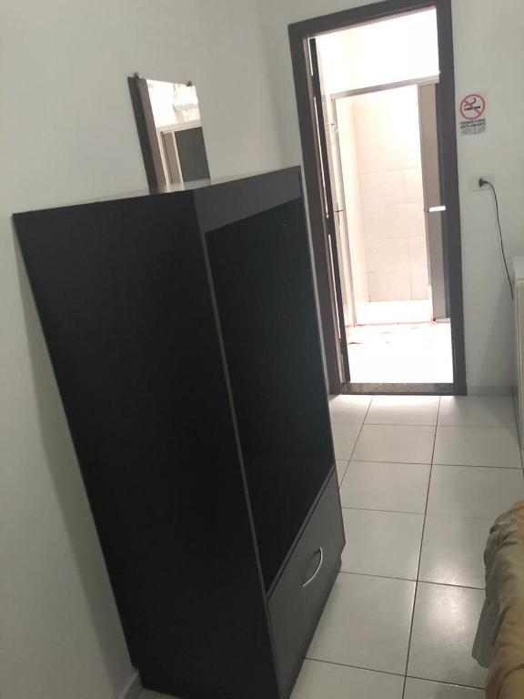 TV a/nebo společenská místnost v ubytování Residence Hotel Ltda