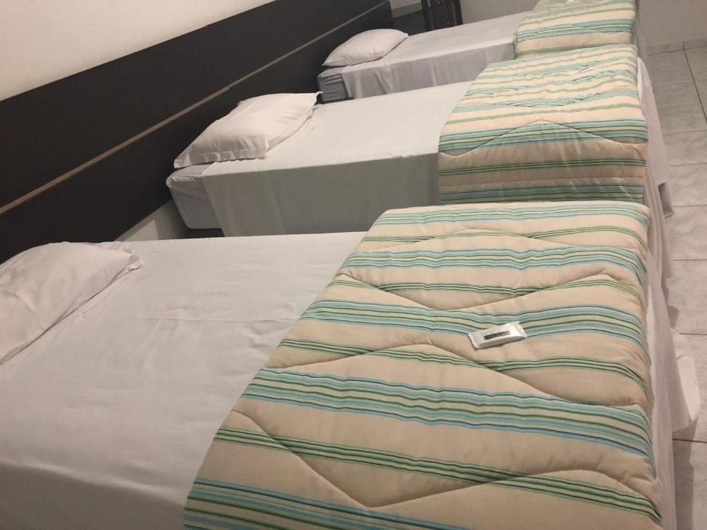 Postel nebo postele na pokoji v ubytování Residence Hotel Ltda