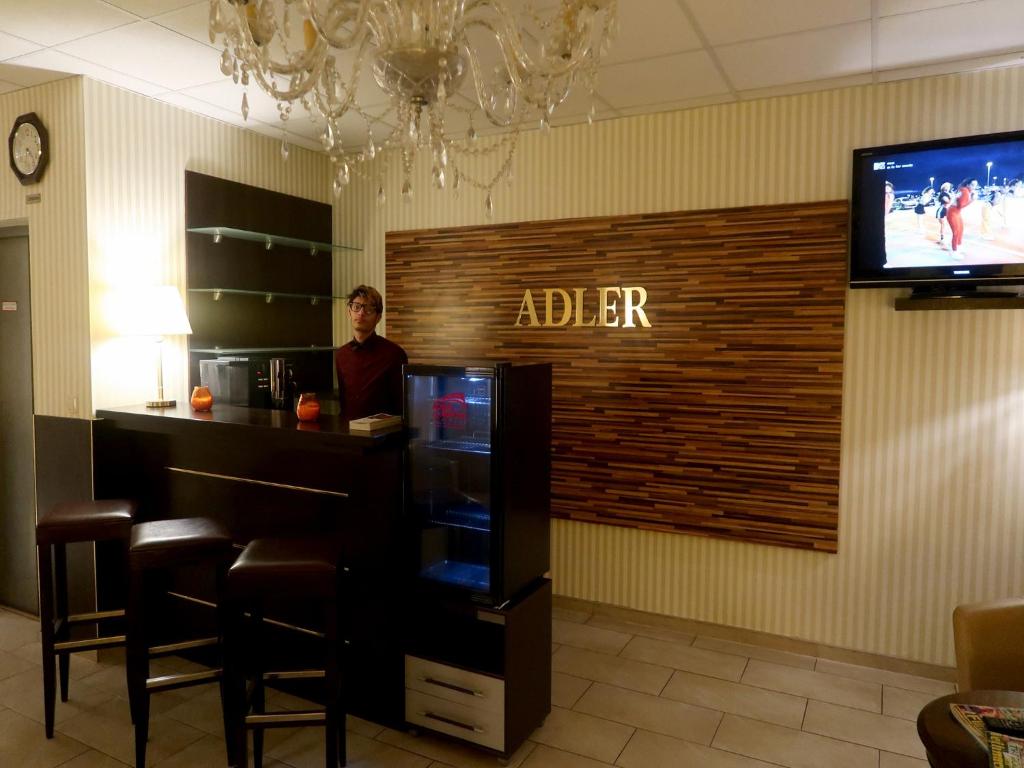 TV a/nebo společenská místnost v ubytování Hotel Adler Leipzig