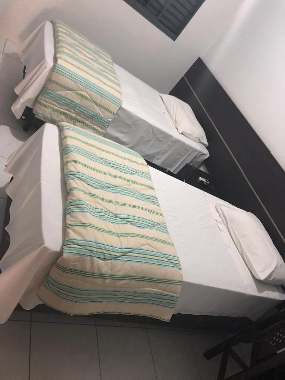 Postel nebo postele na pokoji v ubytování Residence Hotel Ltda